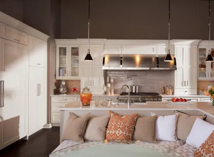 Custom kitchen cabinetry installation with white shaker doors and soft-close hinges