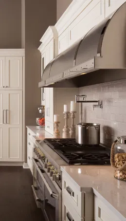 Custom kitchen cabinetry installation with white shaker doors and soft-close drawers