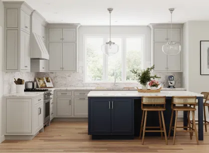 Custom kitchen cabinetry installation showing white shaker style cabinets and drawers