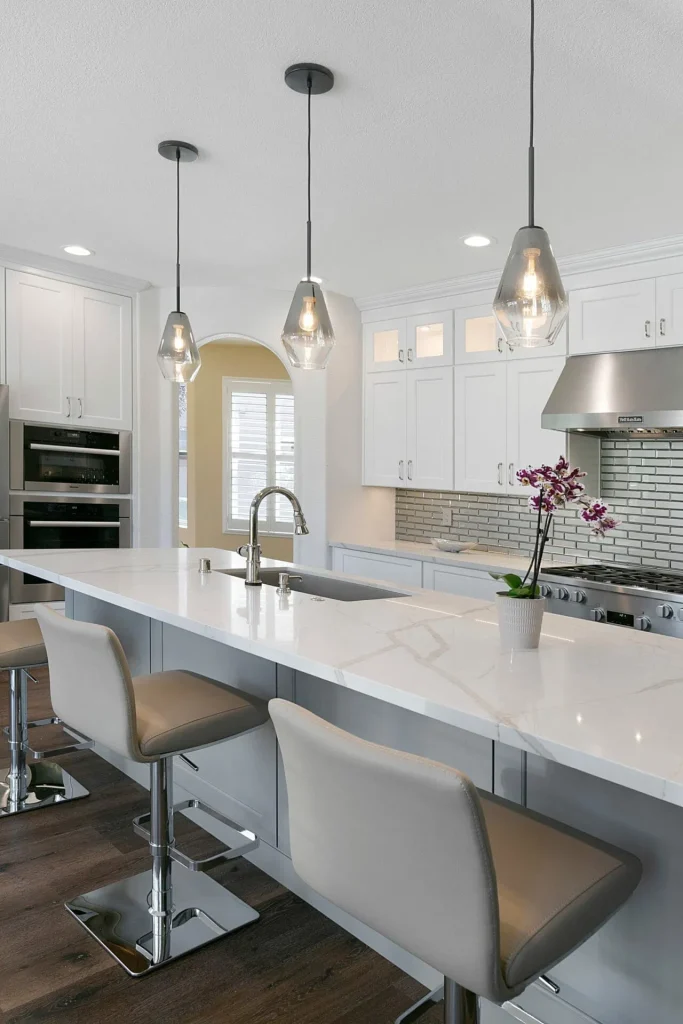 Professional countertop fabrication and installation team working on granite surface in Brentwood kitchen