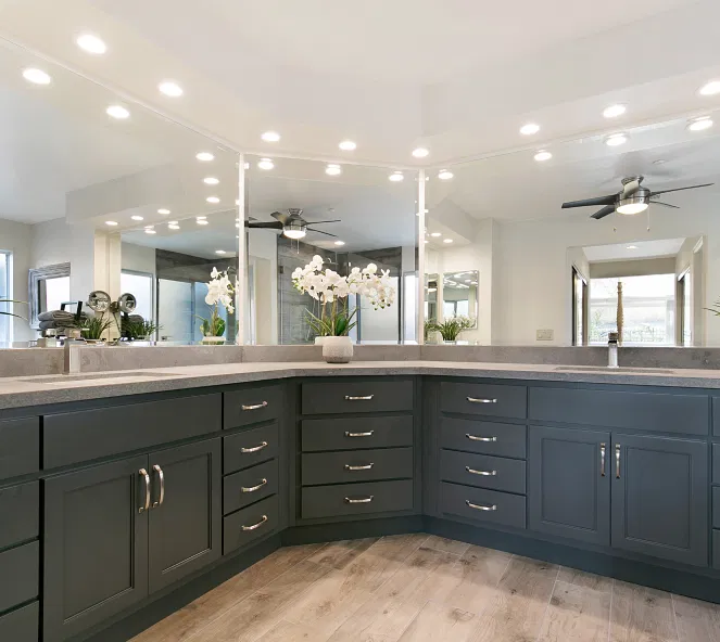 Custom kitchen cabinetry installation showing modern white cabinets with detailed craftsmanship