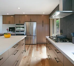 Custom kitchen cabinetry installation showing white shaker style cabinets and drawers